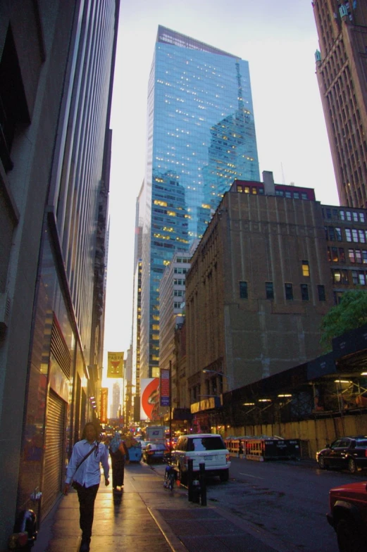 two people walk down the street of an inner city