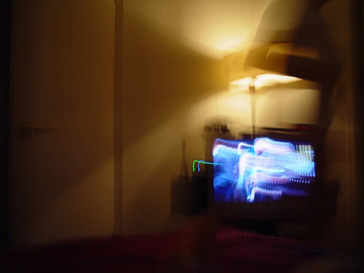 blurry image of the tv screen in the room