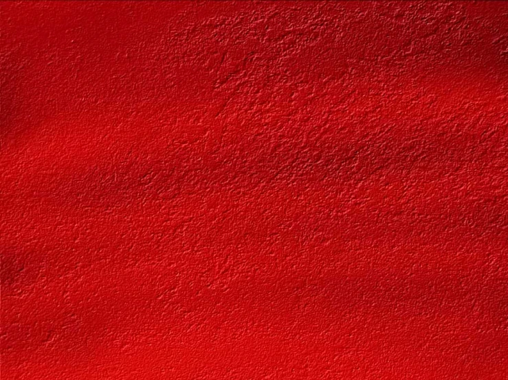 a red wall with many different shades of paint