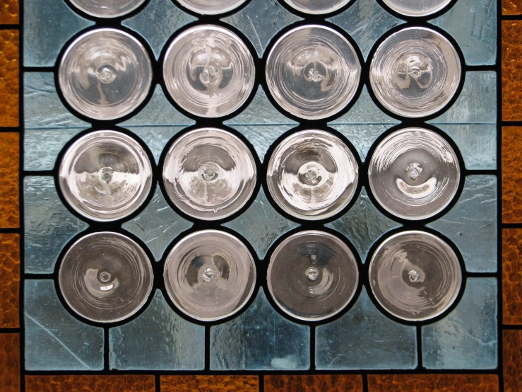 a display of a variety of glass with some silver colored accents