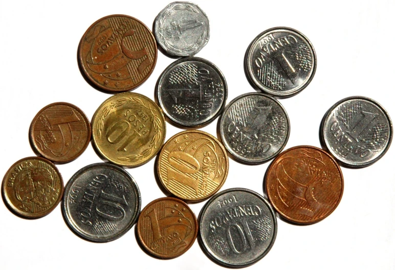 a pile of indian rupee coins on a white background