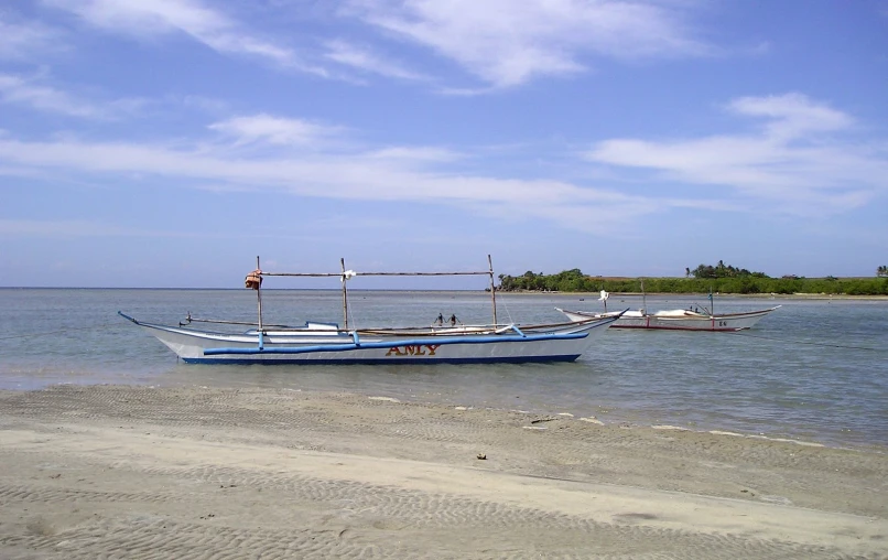 three boats that are sitting in the water