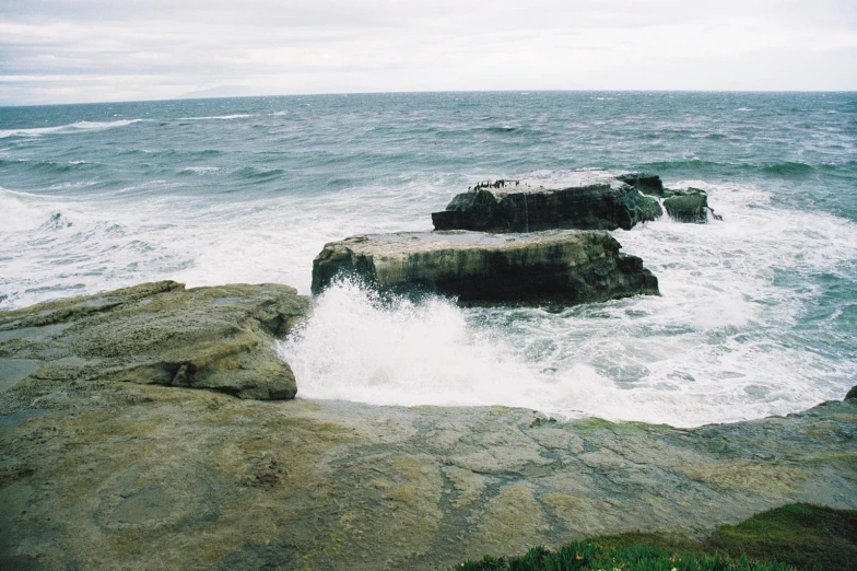 rocks covered with water on the ocean shore