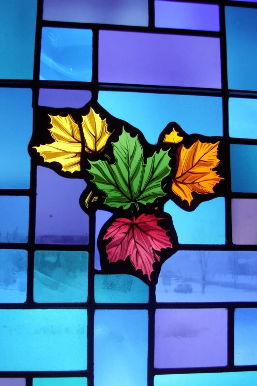 stained glass showing a flower with leaves