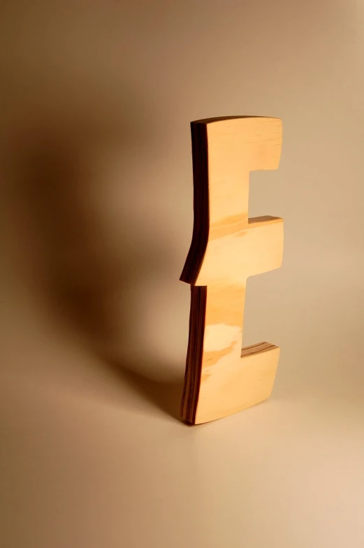 an image of the letter f on a brown background