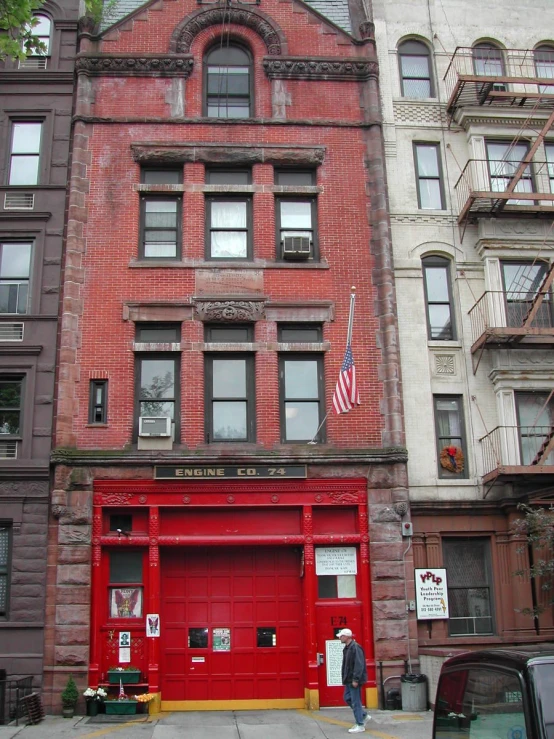 an old firehouse on the corner of an old city street