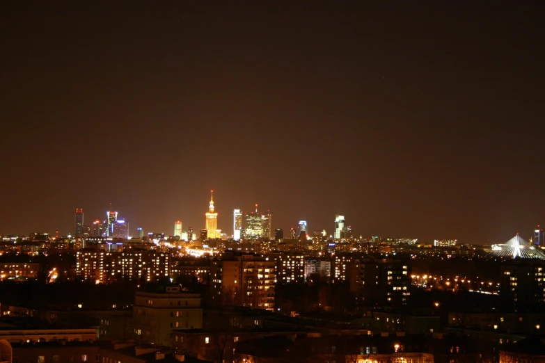 large city with the lights on at night time