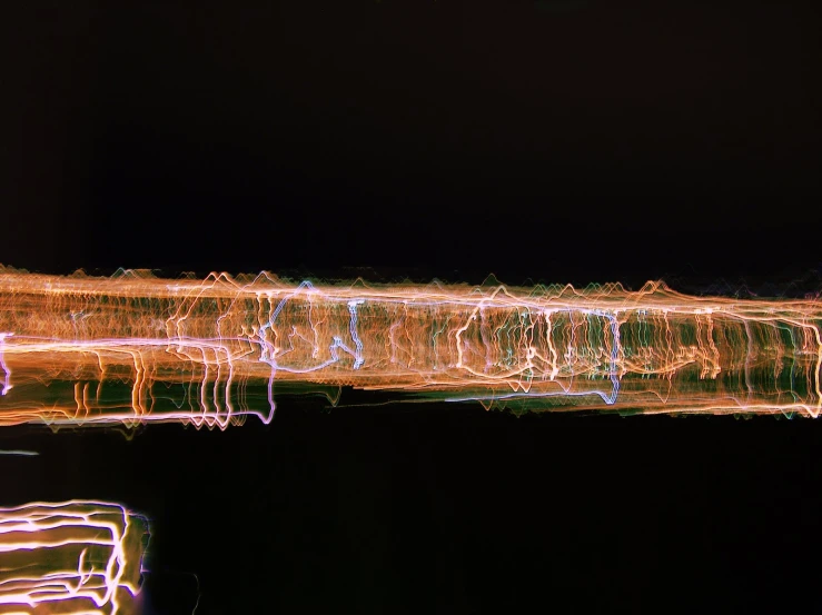 several lights make up the shape of boats in the water