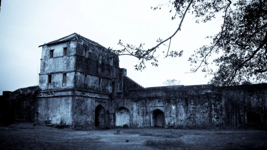 a black and white po of an old house