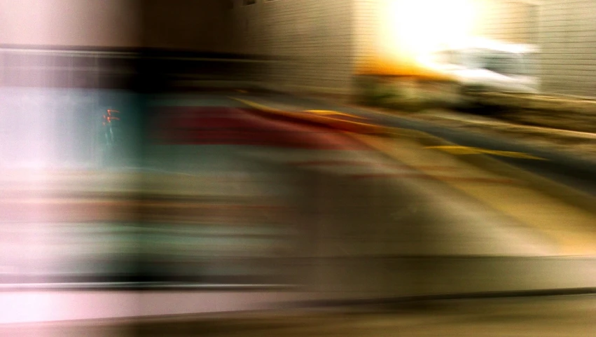 blurry pograph of a man walking by the street