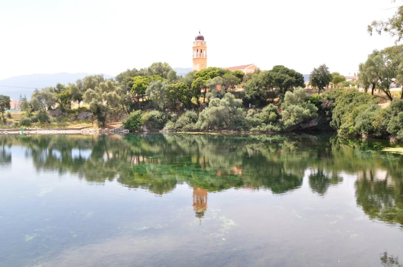 an image of a pond with some trees and water