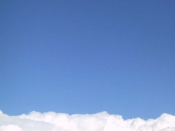 two men standing on top of clouds and snow