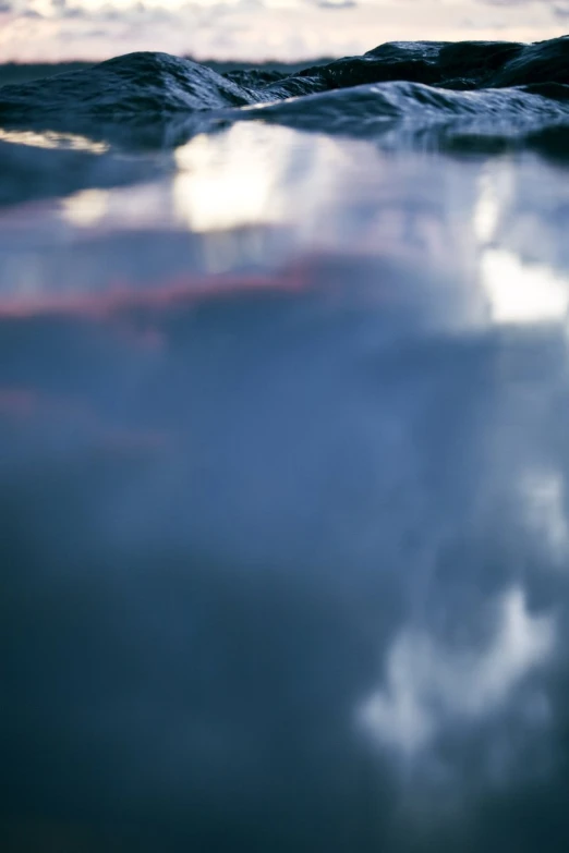 this is a water po of an ocean with clouds