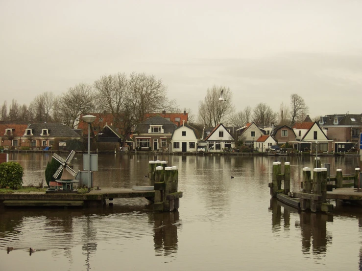 a body of water surrounded by small houses