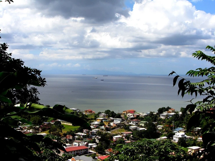 a large body of water with houses next to it