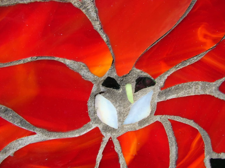 red flower art piece made with stained glass