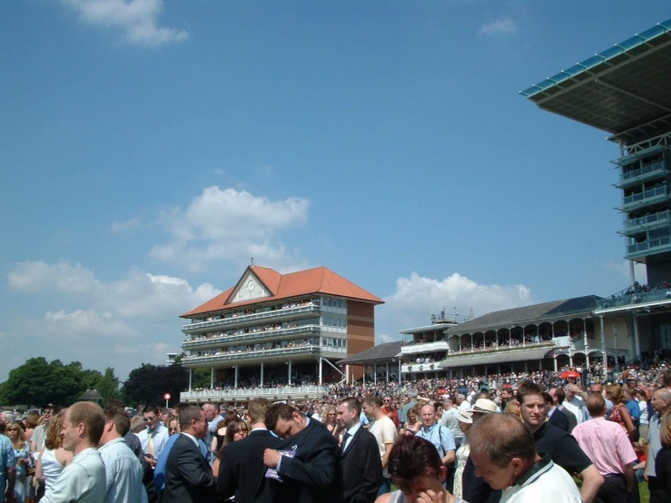 the people at the races are crowded together