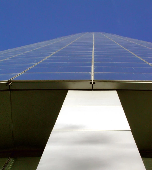 a tall building that has a metal roof