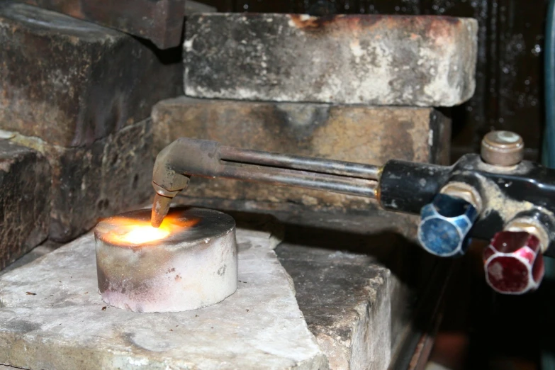 a pipe with fire inside and melting it into small chunks