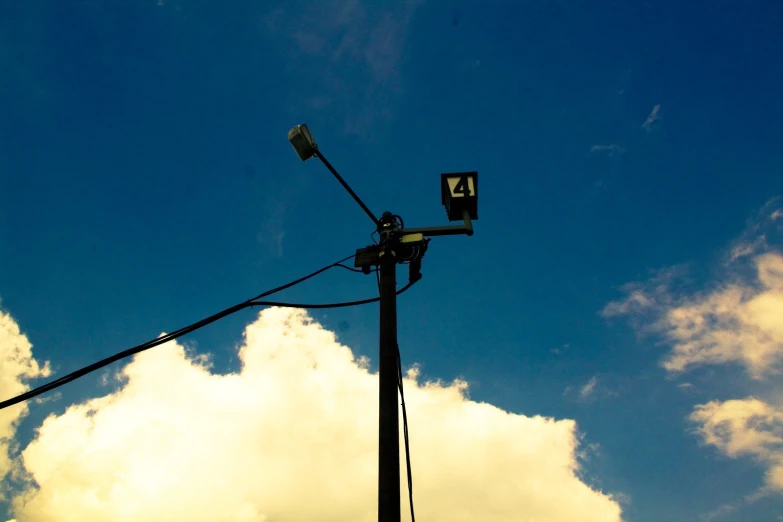 traffic lights are placed in front of a light pole