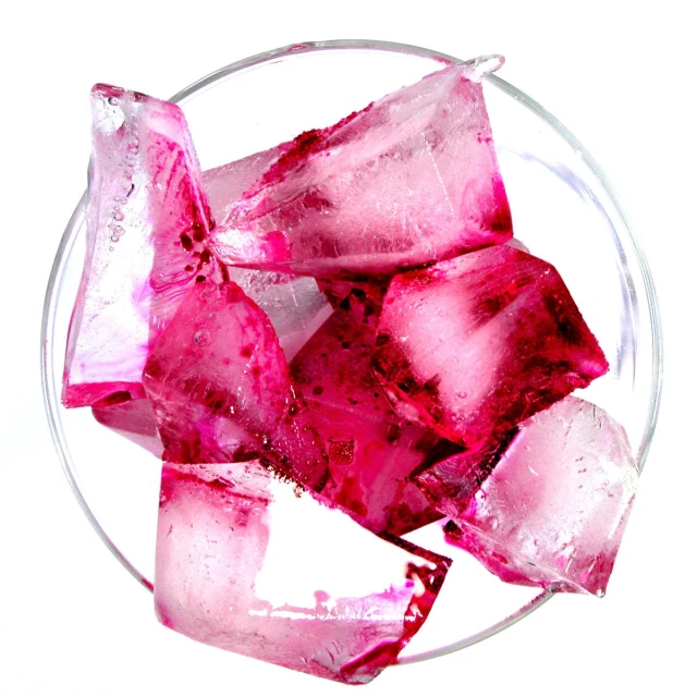 a pile of red crushed ice cubes in a bowl