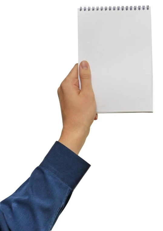 a person holding up a spiral notebook in front of their face