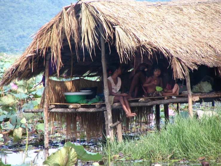 there are people in the hut on a dock