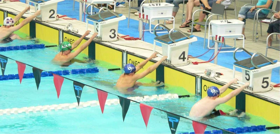 swimmers at the start line in a swimming competition