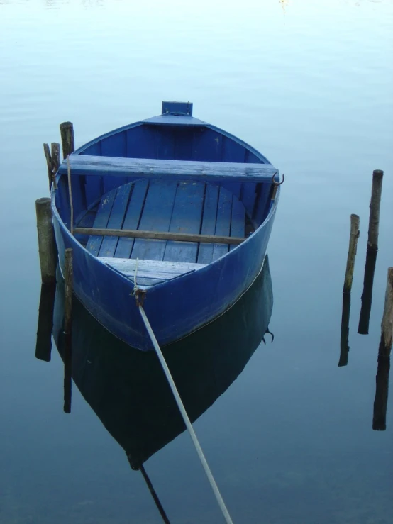 a small boat sitting on top of water