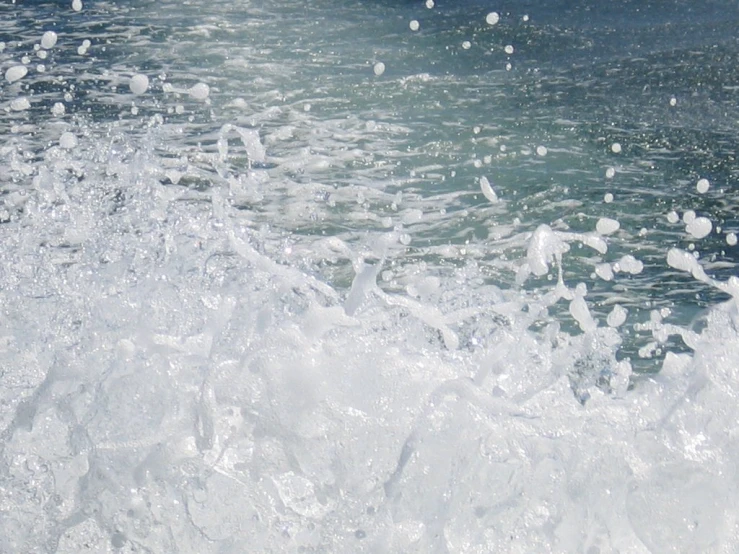 white water splashes on the bottom of a wave