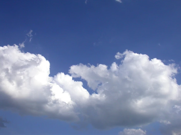 two airplanes flying high in the blue sky