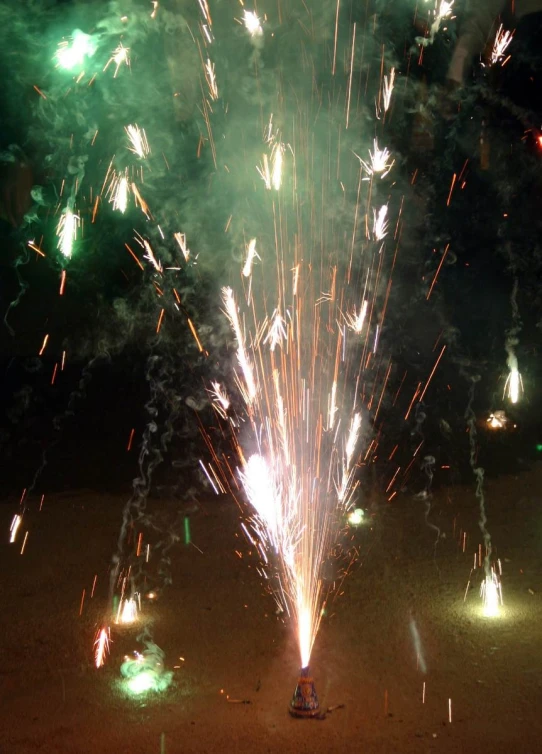 firework displays over an outdoor parking lot