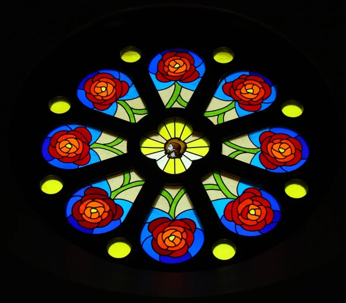 a stained glass window has colorful lights