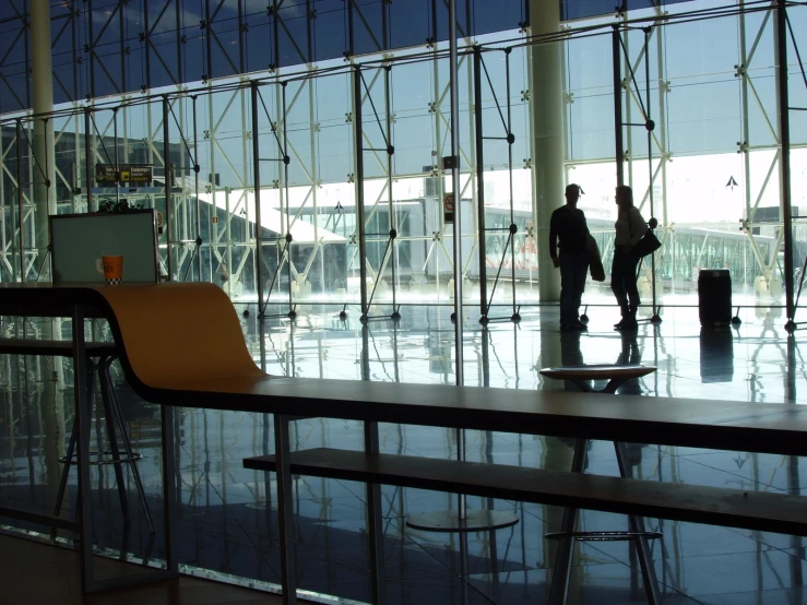 an airport lobby with a long table in front