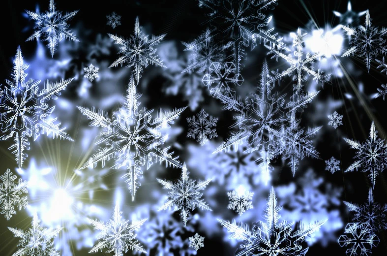 an image of snowflakes that are on the dark background