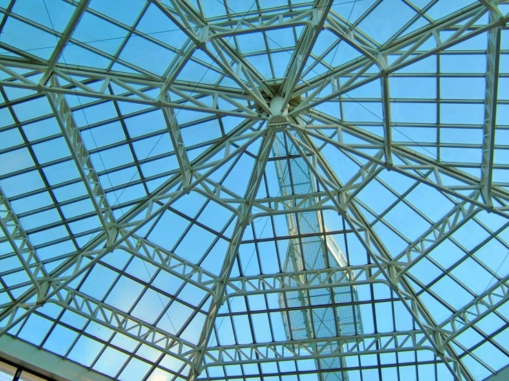 the roof of a building has glass and steel trim