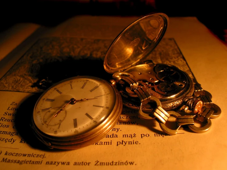 an old pocket watch with many keys and a chain