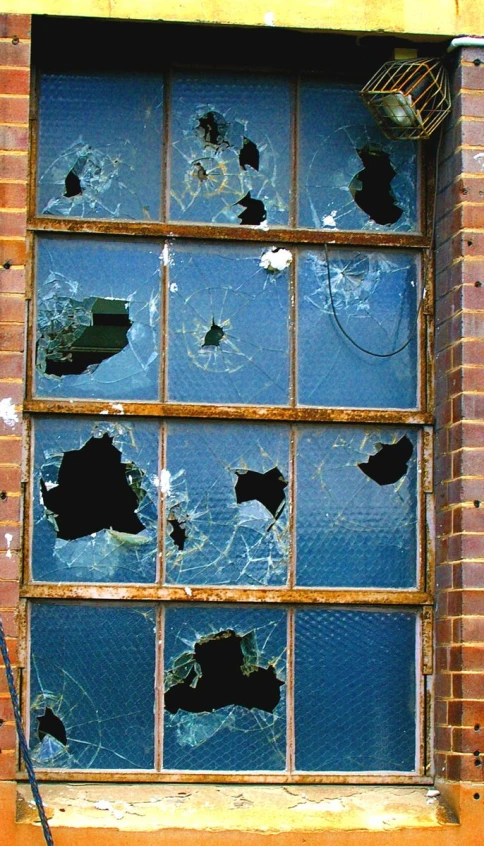 a window that has many broken glass