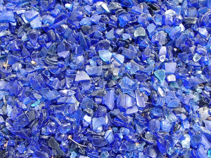 large blue pieces of glass in various sizes and colors