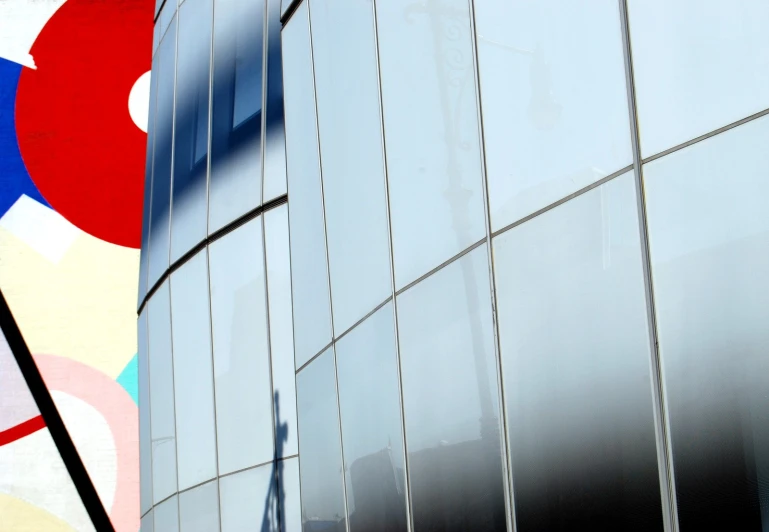 a building with colorful artwork behind it in front of it