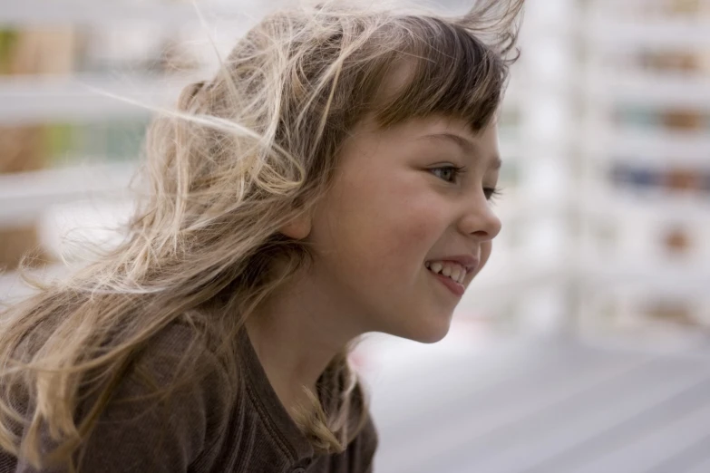 a small blonde girl with long, flowing hair