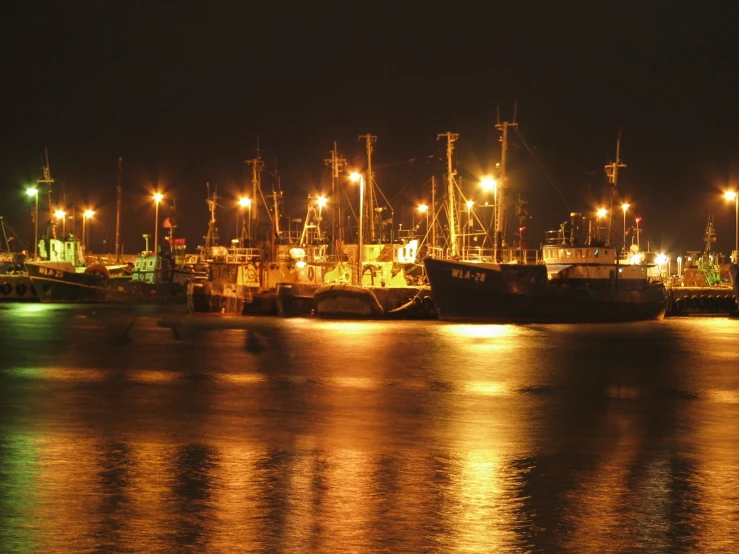 a group of boats floating on top of a body of water