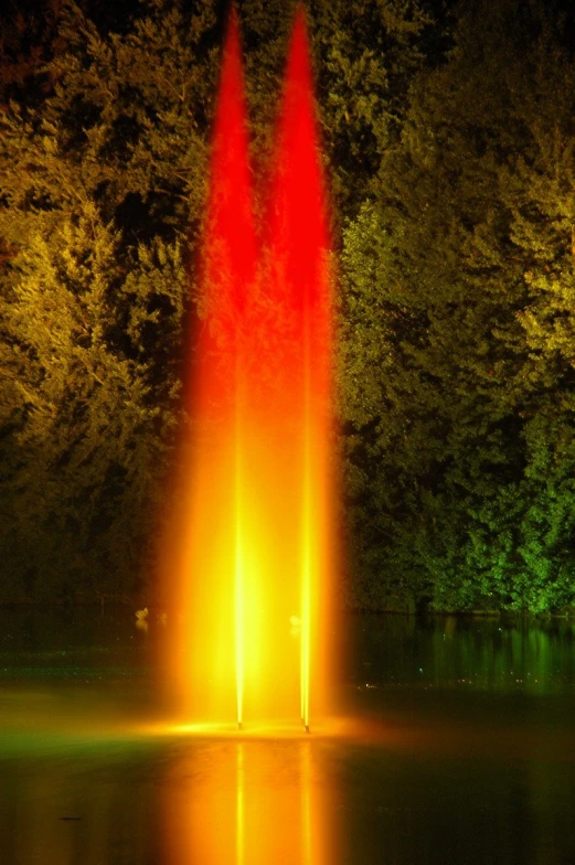 the large red fountain has two large fountains in it