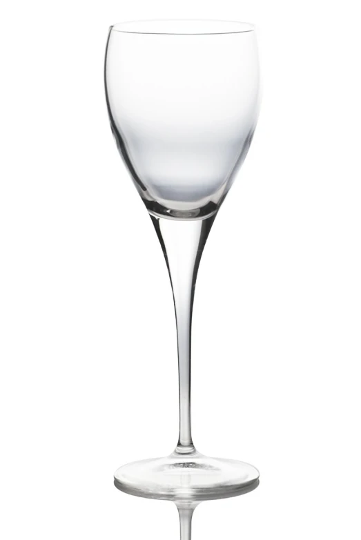 a clear wine glass sitting on top of a table