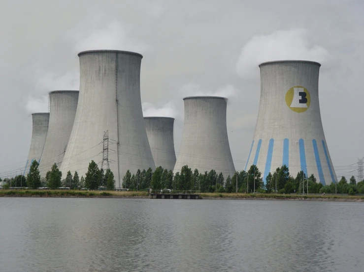 the large cooling towers are built over a lake