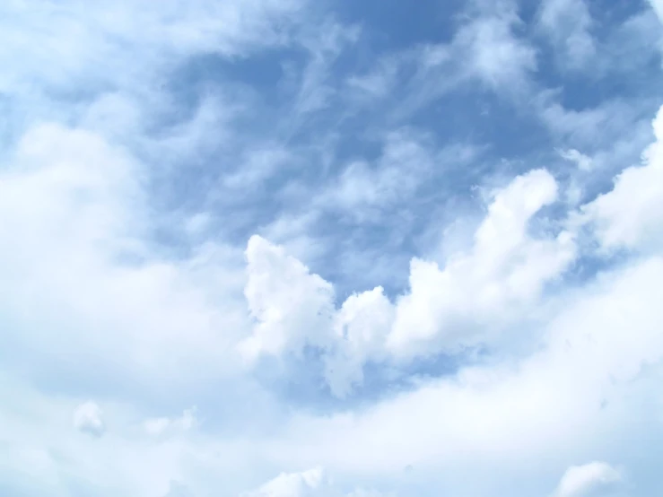 a large airplane flying through the sky