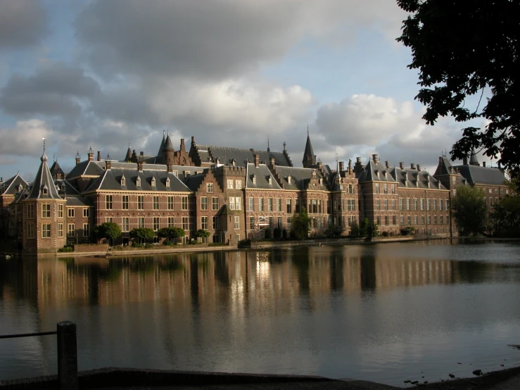 the buildings in the city are reflected in a lake