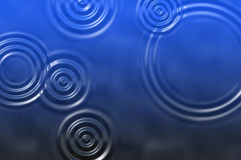 a blue background with circular circles in it