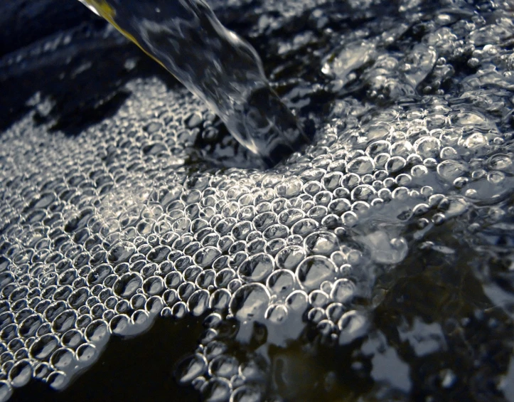 the view from above the surface shows some water droplets and bubbles