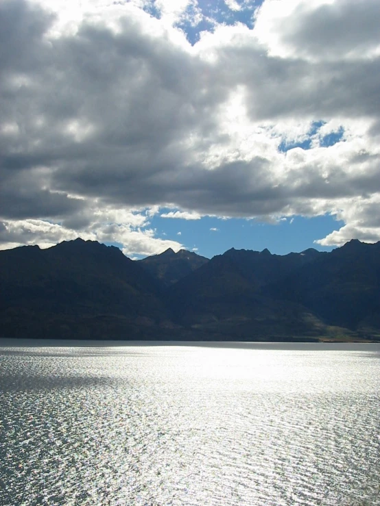 a small boat is floating on the calm water